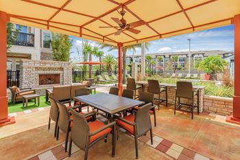 Nona park village apartments pool area outdoor fireplaces with seating