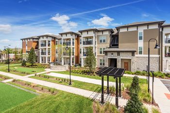 Nona park village apartments pool area bocce ball, horseshoe and corn hole court