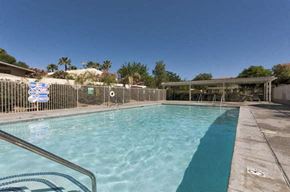 Cathedral City apartment for rent - a swimming pool with a fence around it