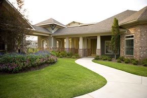 Marietta apartment for rent - a house with a yard and a walkway in front of it
