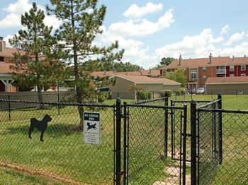 Gated, grassy dog park in our pet-friendly community