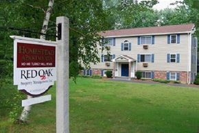 Merrimack apartment for rent - a house with a red oak sign in front of it