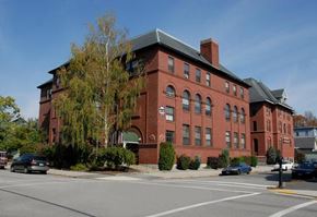 Manchester apartment for rent - a red brick building on the side of a street