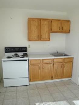 Derry apartment for rent - a small kitchen with a stove and a sink