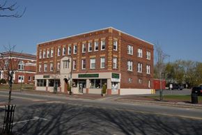 Derry apartment for rent - a large brick building on the corner of a street