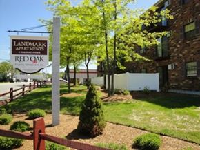 Derry apartment for rent - a yard with a sign in front of a building