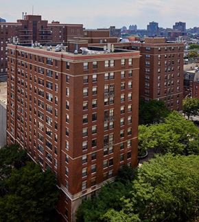 Hoboken apartment for rent - an aerial view of a tall brick building in a city