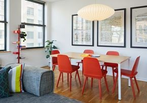 Hoboken apartment for rent - a dining room with a table and chairs and a couch