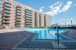 Hoboken apartment for rent - a pool with an apartment building in the background