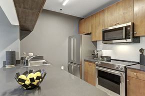 Hoboken apartment for rent - a kitchen with stainless steel appliances and a counter top