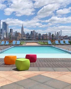 Hoboken apartment for rent - a pool with a city skyline in the background
