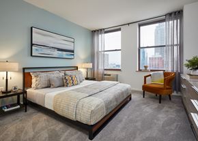 Jersey City apartment for rent - a bedroom with a bed and two windows