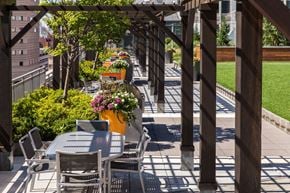 Jersey City apartment for rent - a patio with tables and chairs on a