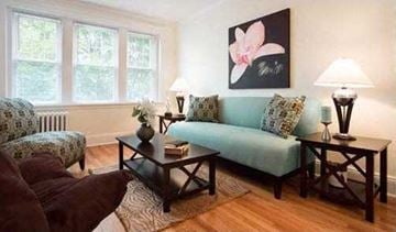 Brighton apartment for rent - a living room with a couch and two tables