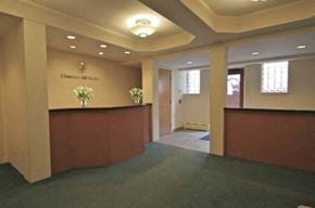 Cambridge apartment for rent - the lobby of a building with a reception desk
