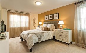 Norwood apartment for rent - a bedroom with a bed and a dresser
