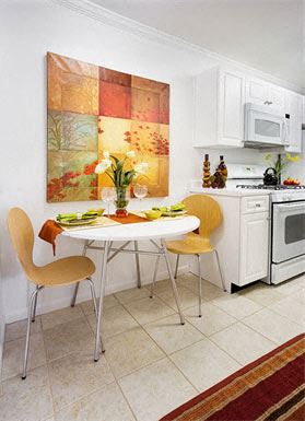 Norwood apartment for rent - a small kitchen with a table and chairs