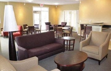 Cincinnati apartment for rent - a living room with a couch and chairs and a table