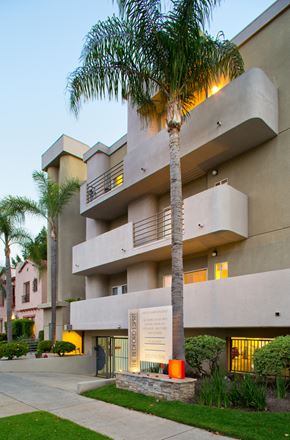 Los Angeles apartment for rent - A cityscape with buildings and a clear sky.