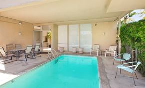 Los Angeles apartment for rent - a swimming pool and patio with chairs and tables