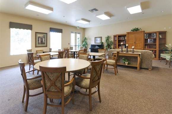 Anaheim apartment for rent - a living room with a round table and chairs