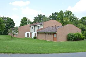 Loveland townhouse for rent - a brick house with a lawn in front of it