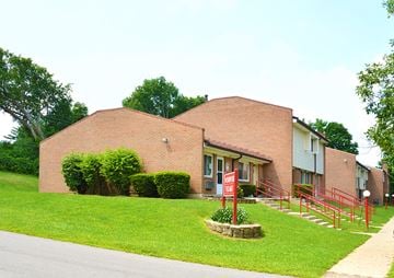 Loveland townhouse for rent - a brick building with a red sign in front of it