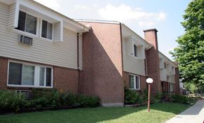 Loveland townhouse for rent - a brick building with a yard in front of it