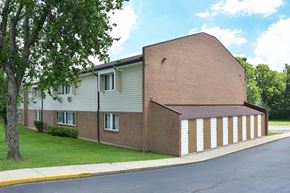 Loveland townhouse for rent - a large brick building with a white garage door