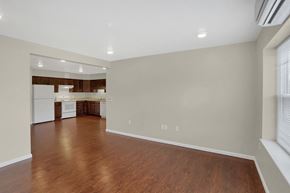 State College apartment for rent - an empty living room and kitchen with wood flooring