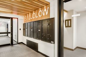Manhattan apartment for rent - a view of the locker room in the hall of a building with the door open