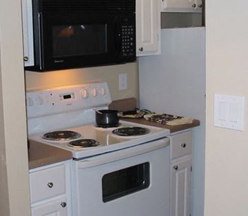 Phoenix apartment for rent - a kitchen with a stove and a microwave