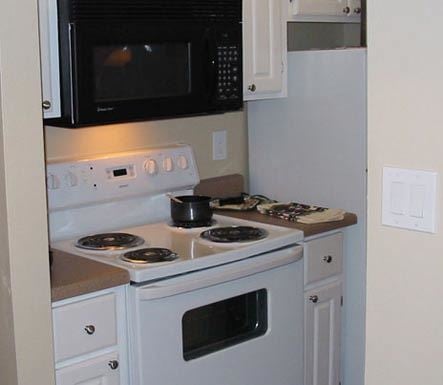 Phoenix apartment for rent - a kitchen with a stove and a microwave