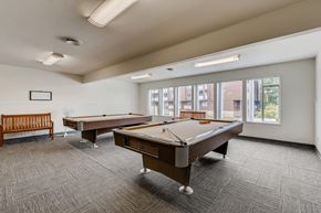 Lakewood apartment for rent - The Community Clubhouse with a Pool Table at Morningtree Park Apartments