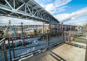 Seattle apartment for rent - a balcony with a view of a city and a bridge