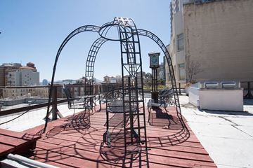 San Francisco apartment for rent - A playground with a red surface and a large metal archway.