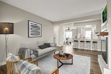 Covina apartment for rent - A living room with a white couch and a coffee table.