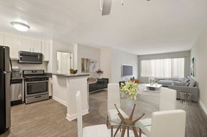 Encino apartment for rent - A modern kitchen with a dining table and chairs.