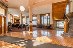 Devils Lake apartment for rent - a large lobby with wood floors and a staircase