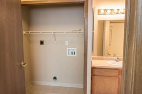 Grand Forks apartment for rent - a bathroom with a shower and a sink and a mirror