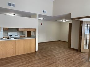 Grand Forks apartment for rent - an empty living room and kitchen with a wood floor