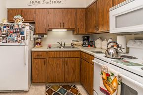 Little Falls apartment for rent - a kitchen with white appliances and wooden cabinets