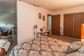 Little Falls apartment for rent - a bedroom with a bed and a desk and a closet