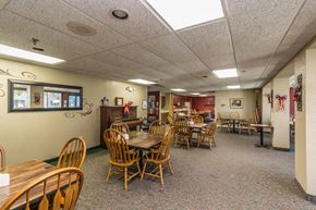 Little Falls apartment for rent - a dining room with wooden tables and chairs in a building