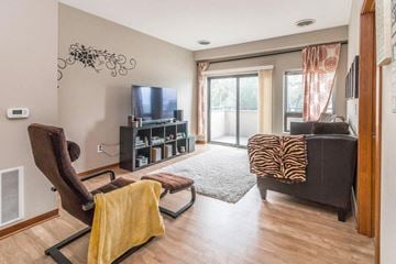 Minneapolis apartment for rent - a living room with a couch and a chair and a television