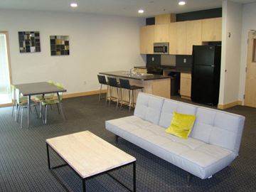 Grand Forks apartment for rent - a living room with a kitchen and a couch