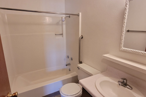 Whitewood apartment for rent - a bathroom with a sink toilet and a bath tub