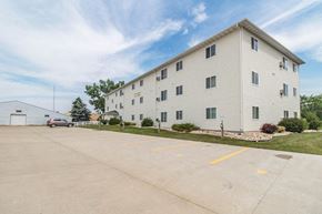 Grafton apartment for rent - a large white building with a car parked in front of it