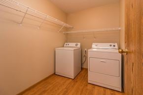 Grafton apartment for rent - a laundry room with two washes and a dryer in it