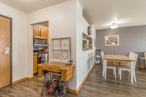 Bismarck apartment for rent - a dining room and kitchen with a wooden table and chairs